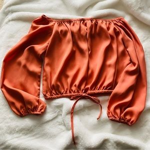 Brand new, never worn, coral blouse. Off the shoulder and flowy.